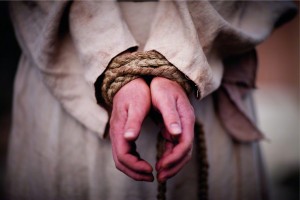 Christ's hands bound with rope