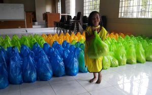 Young LDS member help in the preparation of relief goods