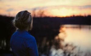 A girl looking at the sunset