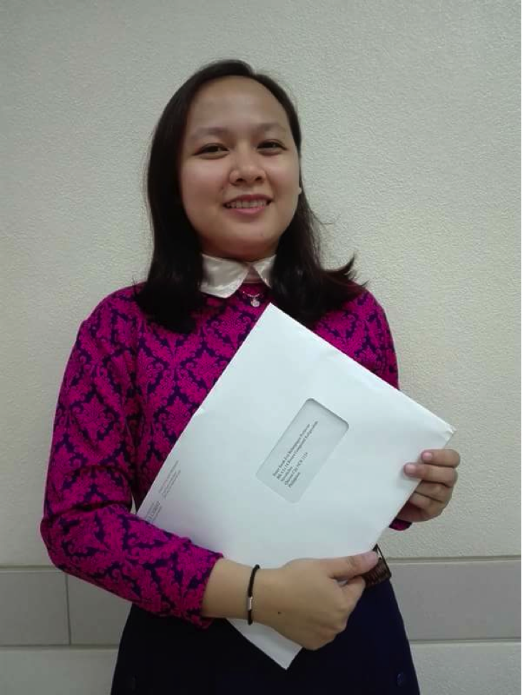 Sister Perlawan holding her mission call