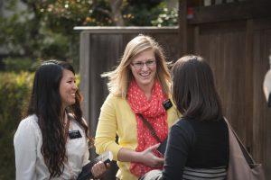 Sister missionaries talking to a woman in the street