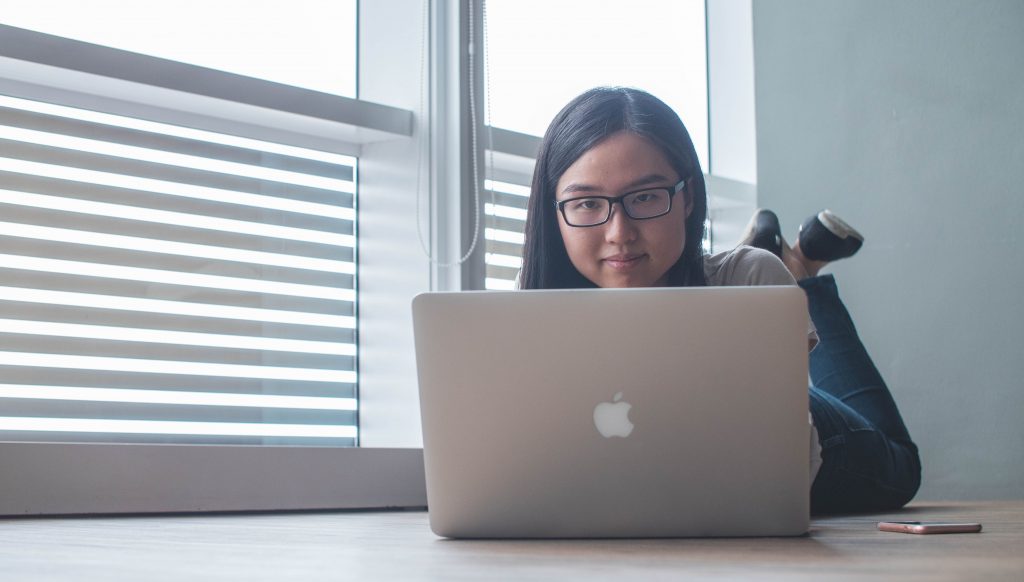 teenager in front of laptop