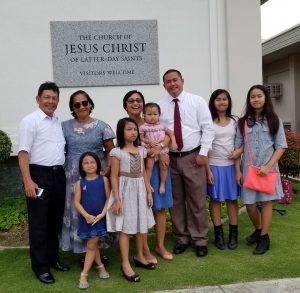 family in front of church