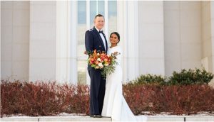 A couple who found love after a heartbreak, posing for a photo after their marriage ceremony at the Mount Timpanogos Temple.